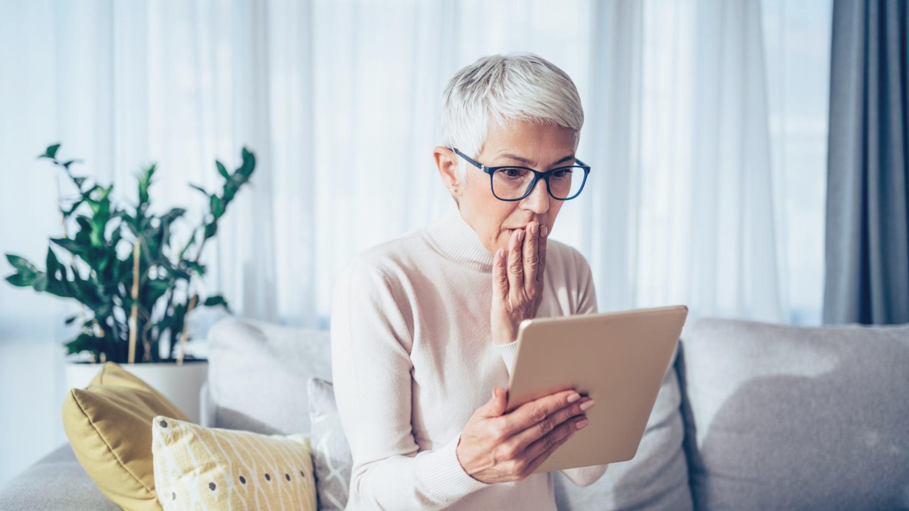 Person analyzing financial charts on computer screen